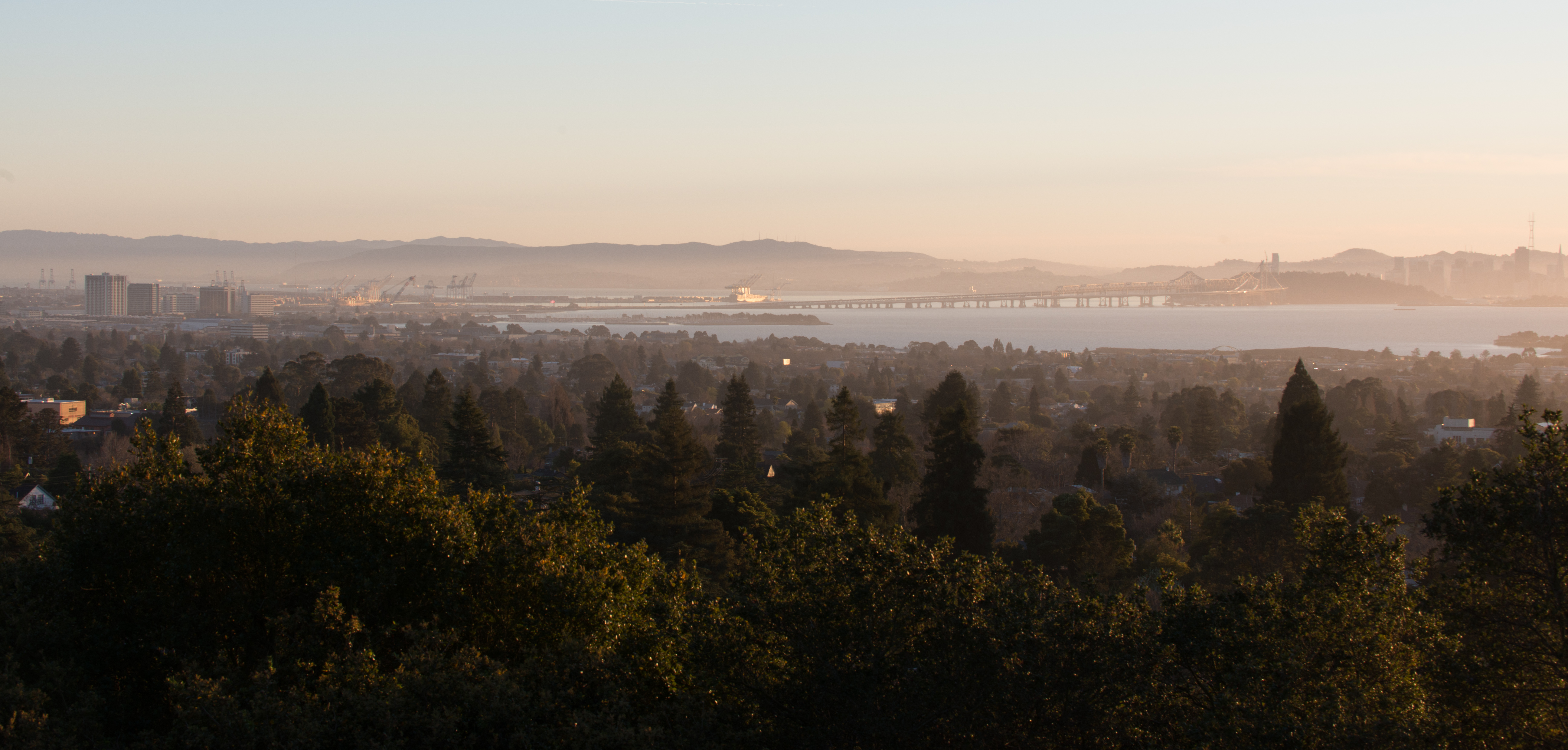 Looking west from Indian Rock in Berkeley, across the East Bay foreground and Bay Bridge toward San Francisco.